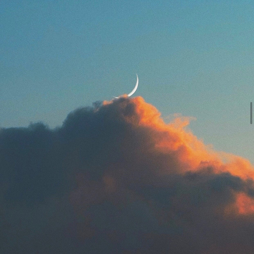 New Moon and clouds